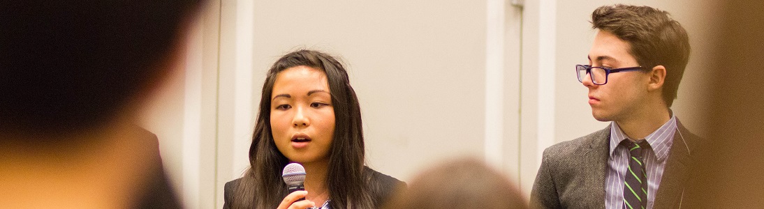 students speaking at thesis conference